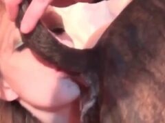 Naughty blonde licks her dog’s ass and penis