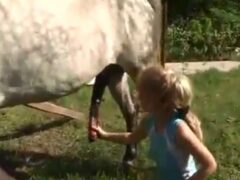 21-year-old blonde gets a horse and sucks its cock